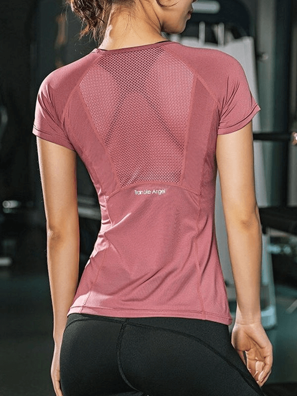 Women's quick-dry sports T-shirt with transparent back, ideal for yoga or workouts, in pink, displayed in active setting. SF0062